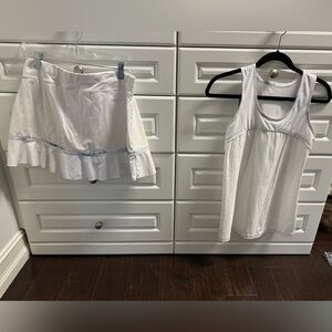2 Sofibella Tennis outfits. Both are mostly white and size Large